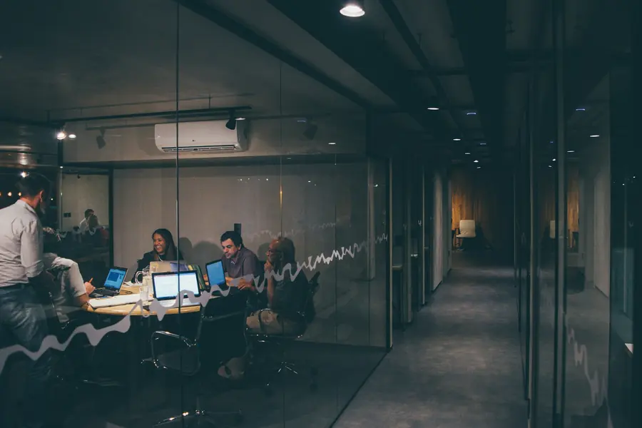 Team meeting in a glass-walled office